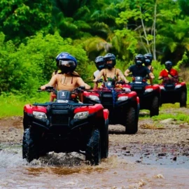 Travelers enjoying a Nassau island tour with ATV buggy and scooter rentals in Nassau Bahamas near beautiful tropical beaches