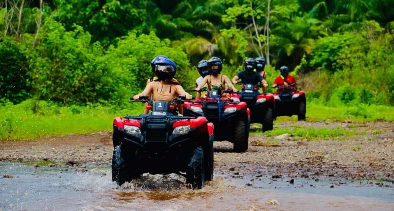 Travelers enjoying a Nassau island tour with ATV buggy and scooter rentals in Nassau Bahamas near beautiful tropical beaches