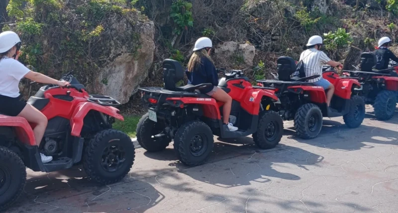 Tourists enjoying the best ATV riding Bahamas Nassau tour while exploring scenic roads and coastal views in Nassau Bahamas
